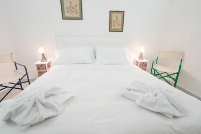 Letto o letti in una camera di Vico Amico by Dimorra