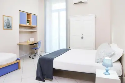 Letto o letti in una camera di CuoreNapoletano Apartment