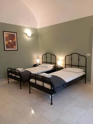 Letto o letti in una camera di Santa Chiara Home Spaccanapoli