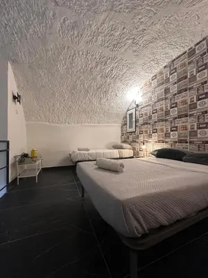 Letto o letti in una camera di Industrial Annarè