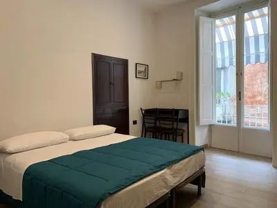 Letto o letti in una camera di FondacOlivella