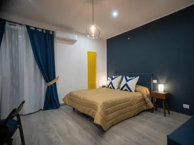 Letto o letti in una camera di Sant'Alfonso Rooms