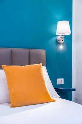 Letto o letti in una camera di Le Porte di Partenope