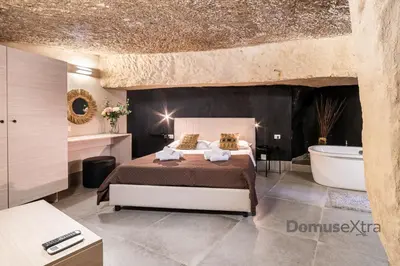 Letto o letti in una camera di La Casa nel Tufo By DomusExtra