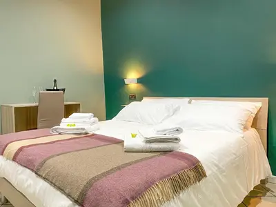 Letto o letti in una camera di Domus Pisanelli
