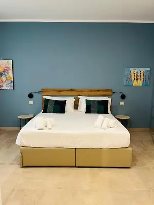 Letto o letti in una camera di Avio Suite