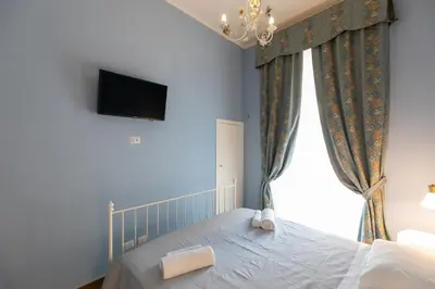 Letto o letti in una camera di Palazzo del Principe San Severo 3 bedrooms & Terrace!