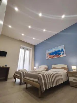 Letto o letti in una camera di La Suite tra i Musei