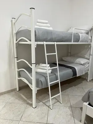 Letto o letti a castello in una camera di La Svolta rooms