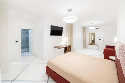 Letto o letti in una camera di Apart Hotel Suite Italy Naples Chiaia Mergellina