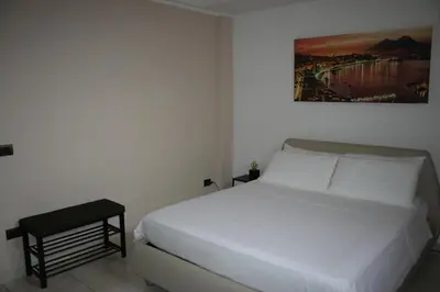 Letto o letti in una camera di Home Napulè