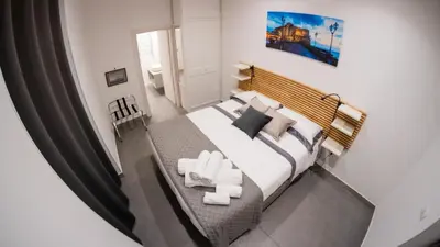 Letto o letti in una camera di Real Passeggio di Napoli
