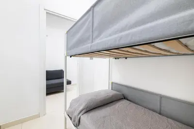 Letto o letti in una camera di La Casa di Manila