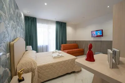 Letto o letti in una camera di P.C. Boutique H. LifeStyle, Napoli Centro, by ClaPa Group Dislocated Hospitality