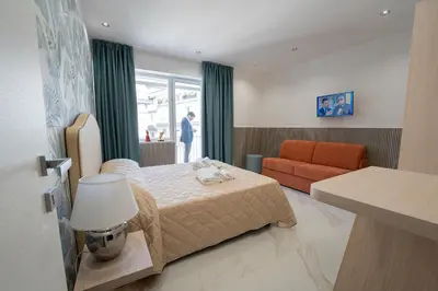 Letto o letti in una camera di P.C. Boutique H. LifeStyle, Napoli Centro, by ClaPa Group Dislocated Hospitality