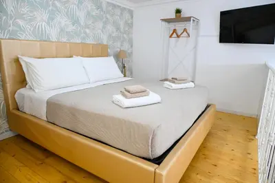 Letto o letti in una camera di Victry's Houses Chiaia