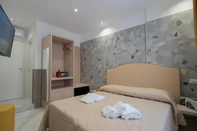 Letto o letti in una camera di GreRos H. Rooms Napoli Centro by Clapa Group Dislocated Hospitality