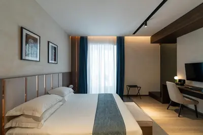 Letto o letti in una camera di Agra Suites