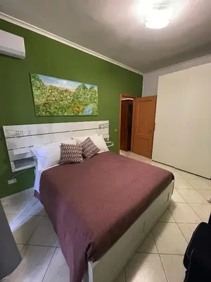 Letto o letti in una camera di Renza House Chiaia
