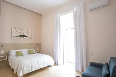 Letto o letti in una camera di Leone Suites Toledo