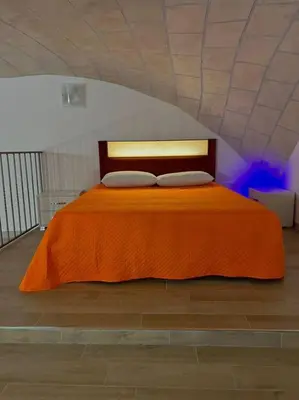 Letto o letti in una camera di Casa Vacanza , Marianna