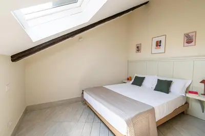 Letto o letti in una camera di Les Maisons Napoli