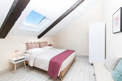 Letto o letti in una camera di Les Maisons Napoli