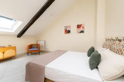 Letto o letti in una camera di Les Maisons Napoli