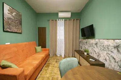 TV o dispositivi per l'intrattenimento presso Flowers House casa vacanze