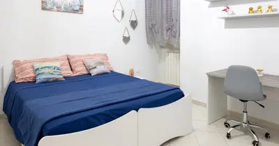 Letto o letti in una camera di Decumani apartments - nel cuore di Napoli