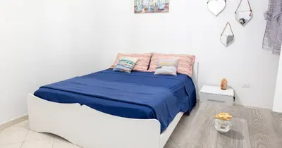 Letto o letti in una camera di Decumani apartments - nel cuore di Napoli