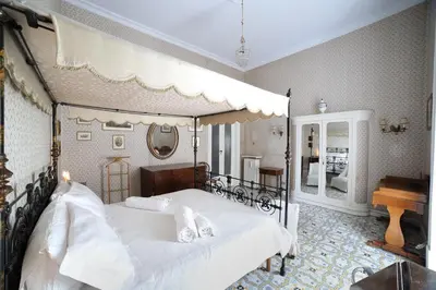 Letto o letti in una camera di Conservatorio 16 Rooms centro storico