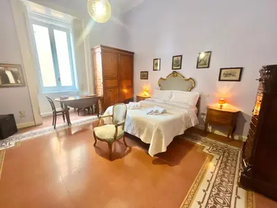Letto o letti in una camera di Conservatorio 16 Rooms centro storico