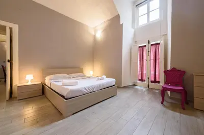 Letto o letti in una camera di Via Atri 37