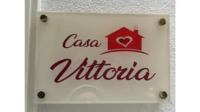 Certificato, attestato, insegna o altro documento esposto da Vittoria's home near Maradona mural