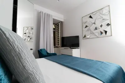 Letto o letti in una camera di Daymoon House Merliani, Vomero