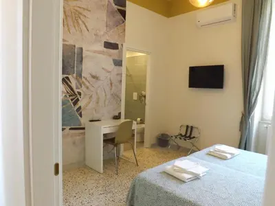 Letto o letti in una camera di Terrazza il Miglio